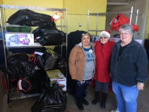 Marlene Hamblin with Santa's Closet volunteers dropping off toys at the Santa's Closet location in Danube, Minnesota.